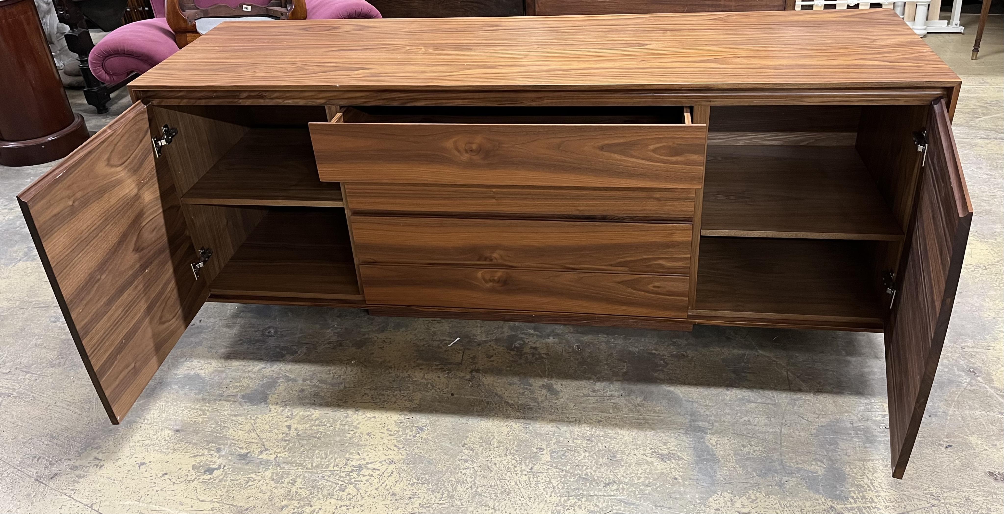 A Contemporary American black walnut sideboard, by Chartwood design Ltd., width 200cm, depth 55cm, height 77cm. Condition - fair to good